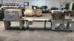 Automatic L-sealer with shrink tunnel.