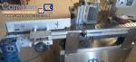 Automatic self-adhesive labeling machine for cylindrical bottles