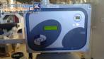 Automatic self-adhesive labeling machine for cylindrical bottles