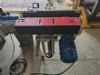 Automatic self-adhesive labeling machine for cylindrical bottles