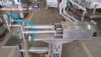 Semi-automatic pneumatic liquid filling machine with two nozzles