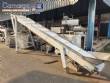 Inclined conveyor belt with talisca