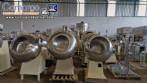 Set of ten stainless steel coating pans with capacities between 150 liters and 350 liters