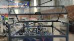 Pick and place product feeder for flowpack transfer cartoning machine