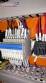 Pick and place product feeder for flowpack transfer cartoning machine