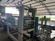 Automatic baling machine with shrink tunnel for bottles and jars in bales.