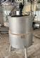 Jacketed mixing tank with heating element, made of stainless steel.