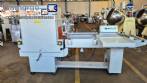 L-shaped packaging sealer with semi-automatic shrink tunnel.