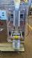 Dosing and packaging machine for granular and powdered products