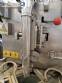 Vertical wrapping machine for triangular format