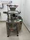 Automatic volumetric dosing packaging machine for powder products.