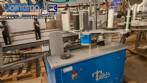 Automatic double-head labeling machine for cylindrical and flat bottles, Tudela, 3,000 labels per hour.