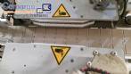 Automatic double-head labeling machine for cylindrical and flat bottles, Tudela, 3,000 labels per hour.