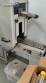 Label applicator machine with steam-operated shrink tunnel for sleeves.