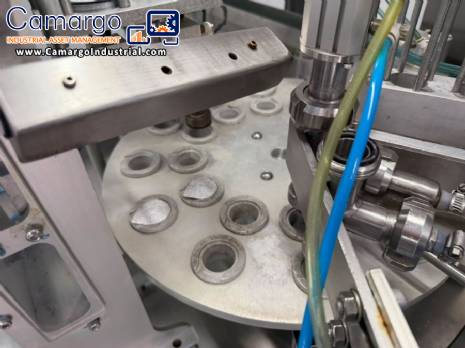 Automatic rotary filling, dosing, and sealing machine for communion cups and small cups.