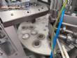 Automatic rotary filling, dosing, and sealing machine for communion cups and small cups.