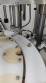 Rotary filling line for dropper bottles with Certo cylindrical self-adhesive labels