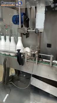 Labeling machine with steam sleeve tunnel and bottle baler