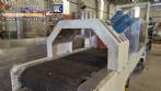 Labeling machine with steam sleeve tunnel and bottle baler