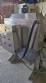 Labeling machine with steam sleeve tunnel and bottle baler