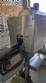 Labeling machine with steam sleeve tunnel and bottle baler