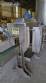 Labeling machine with steam sleeve tunnel and bottle baler