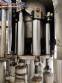 Zegla rotary filling machine with rinser and three-block capping system.