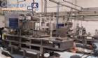 Automatic filling and sealing machine for gelatin cups, 12,000 units/hour.