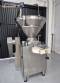 Handtmann vacuum stuffer with twister and tilting elevator, up to 6,000 kg per hour.