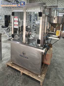Innovar Rotary dosing and filling machine with sealer and capper for jars, cups, and bottles Innovar Rotary dosing and filling machine with sealer and capper for jars, cups, and bottles